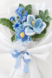 Blue Lily with Calla Lily and Forget-Me-Not Bouquet by Foxchill, handmade crochet flowers, angled close-up of the yarn flowers