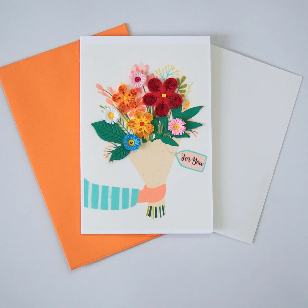 For You quilled greeting card with a colorful paper flower bouquet held by an illustrated hand shown with envelope and message insert
