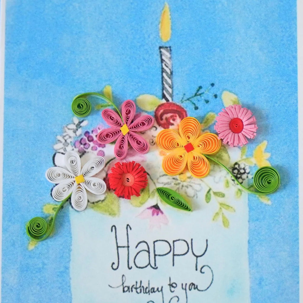 Detail of raised paper flowers decorating a birthday cake illustration
