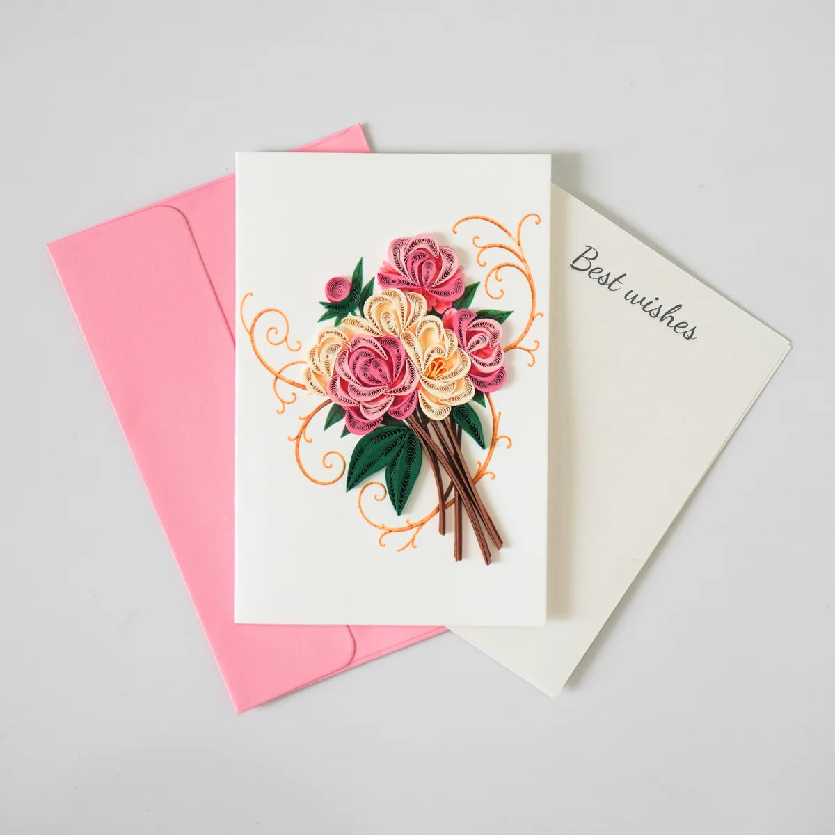 Pink and ivory rose bouquet quilled greeting card with green paper leaves shown with envelope and message insert