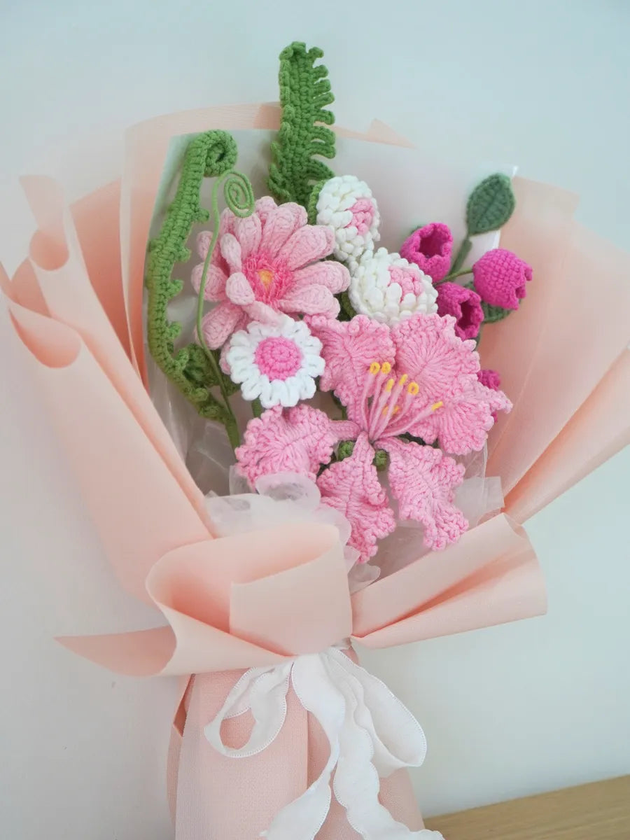 Pink Lily with Daisy and Bellflower Bouquet by Foxchill, handmade crochet flowers, front view of the wrapped bouquet